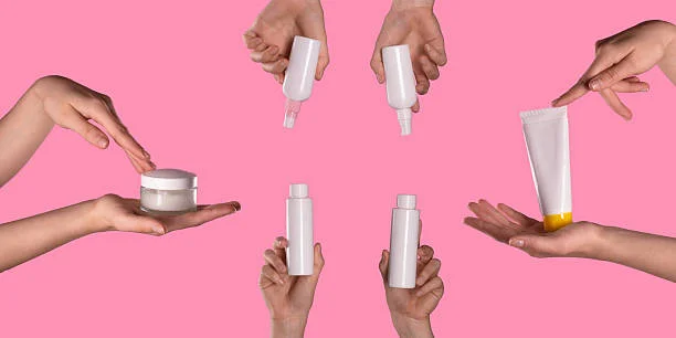 Top 3 Best Face wash for Dry Skin- Hands Holding Hydrating Skincare Bottles